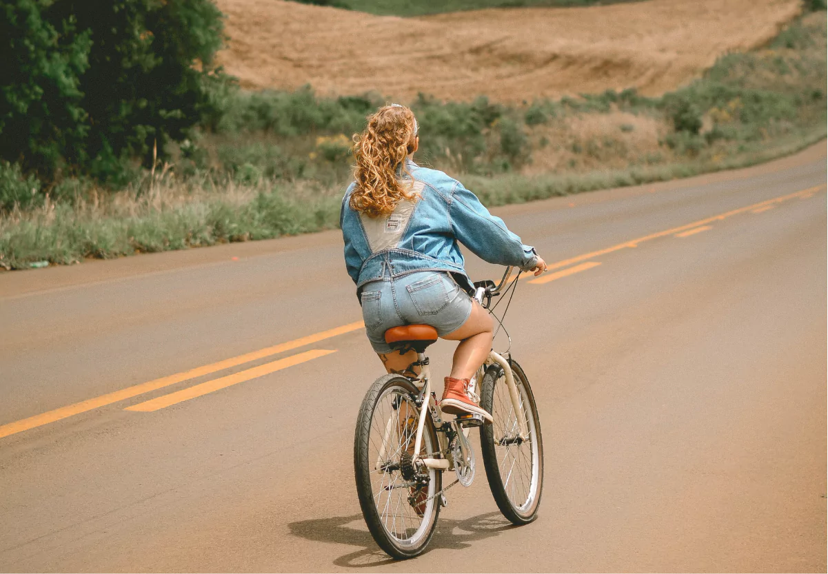 a girl riding a bike