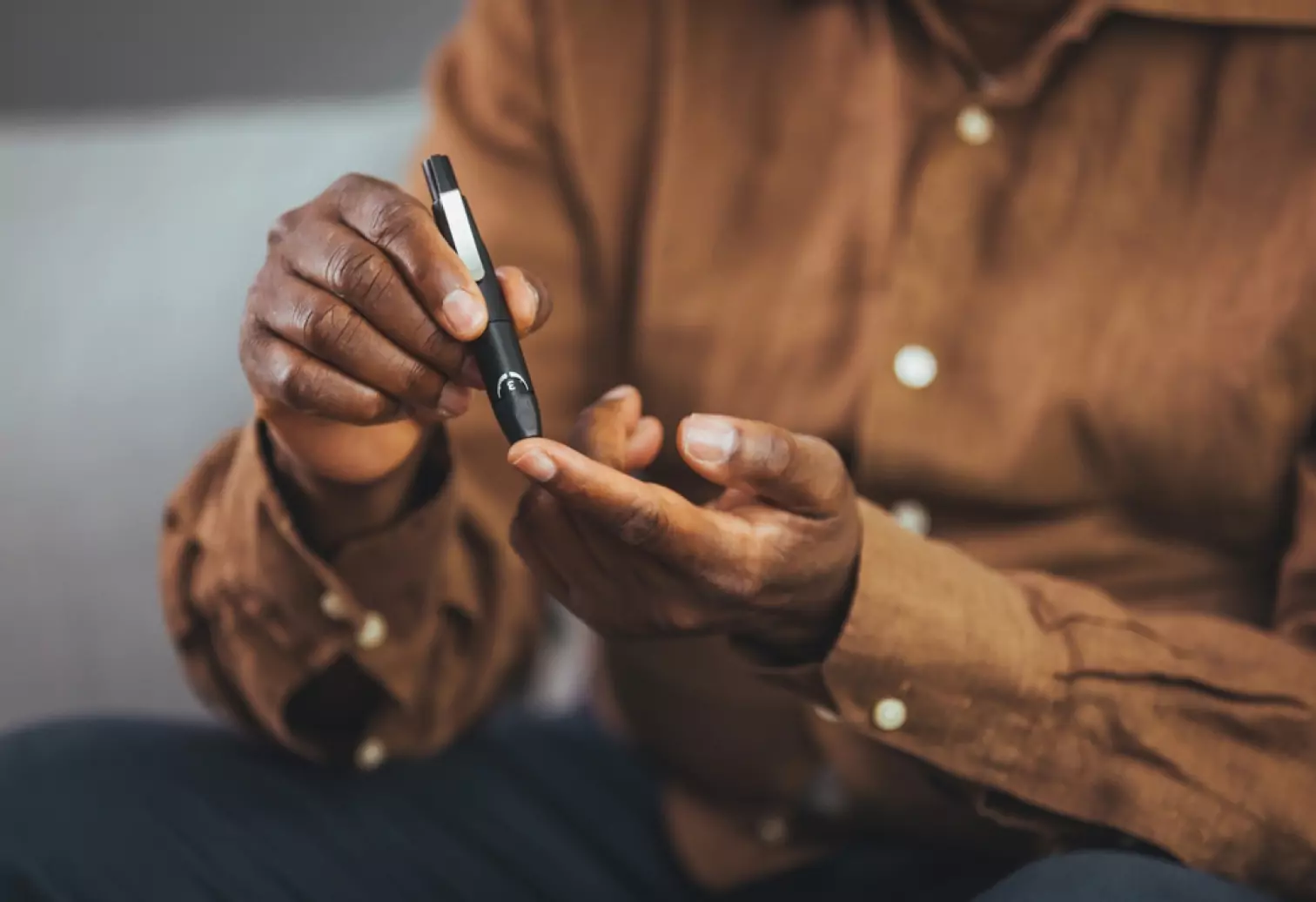 someone using a glucose test