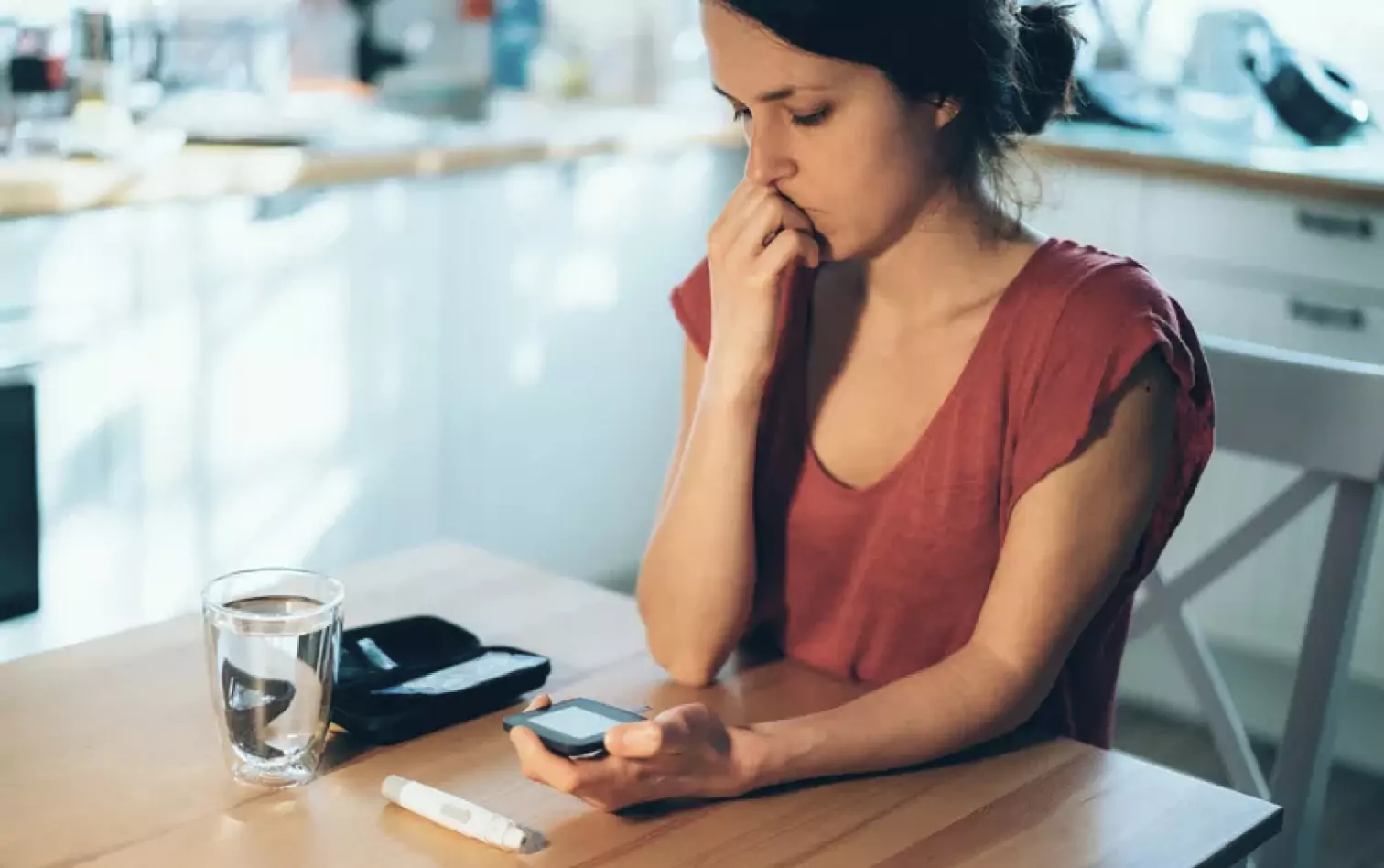 a person checking their glucose level 