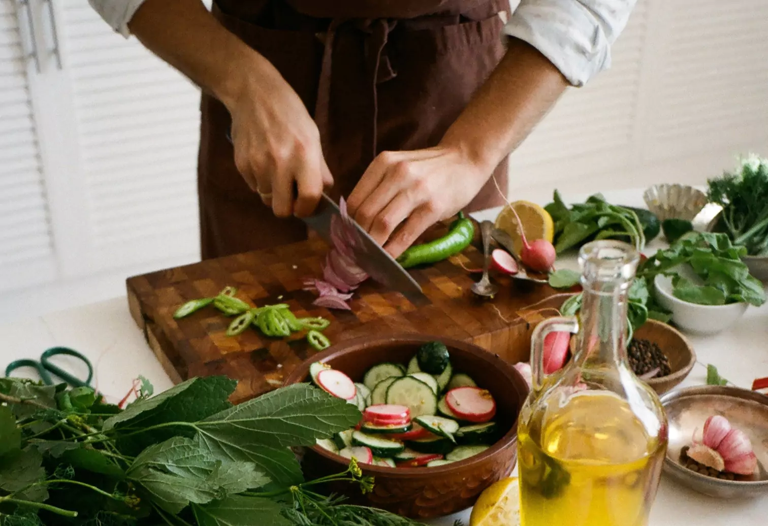 a person chopping vegetables