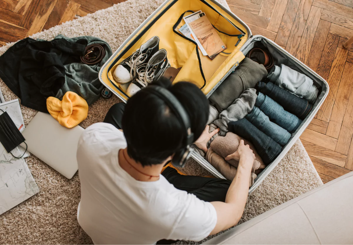 someone packing their suitcase for a trip