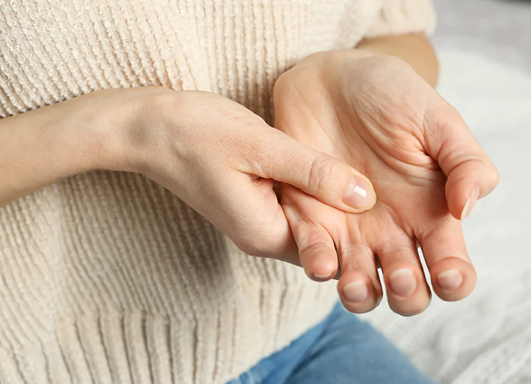 someone with hand pain