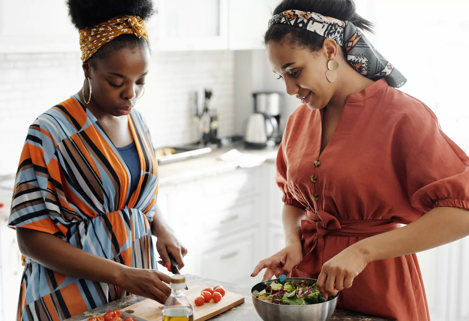 two girls making a salad