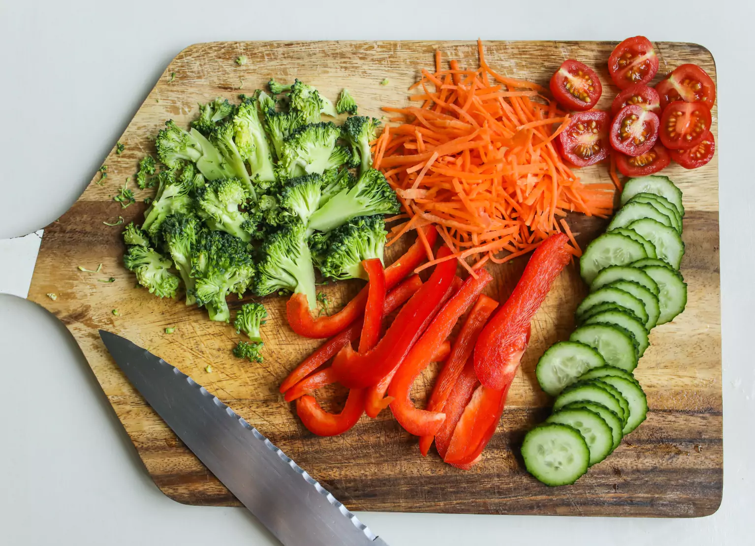a cutting board filled with veggies