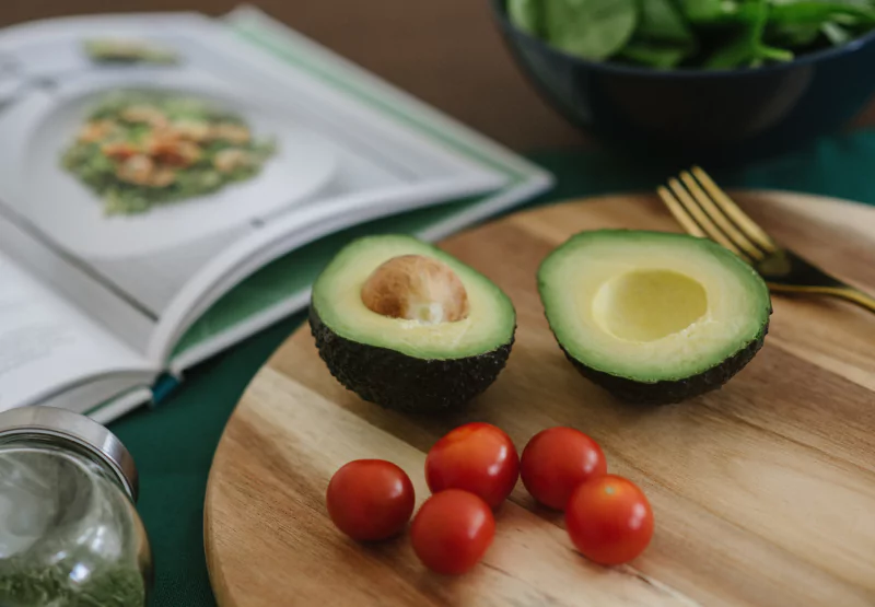 a sliced avocado on a cutting board
