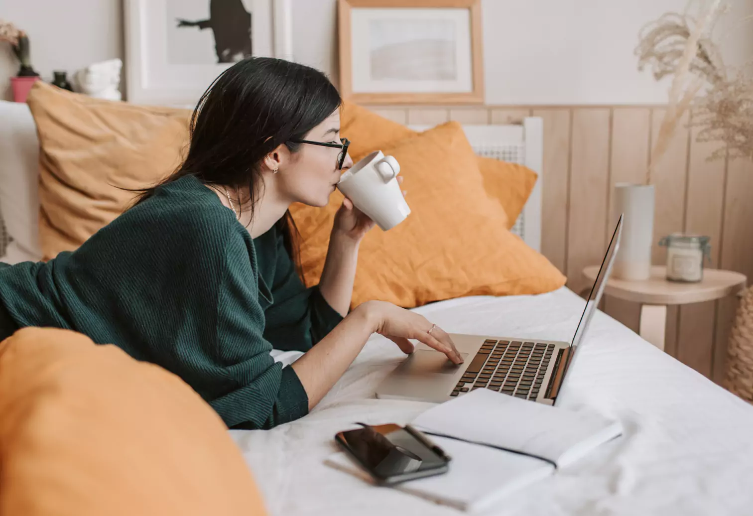 a girl drinking water and working
