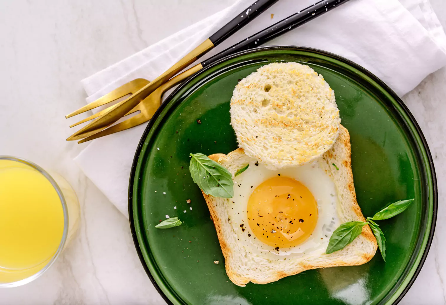 plate with an egg sandwich