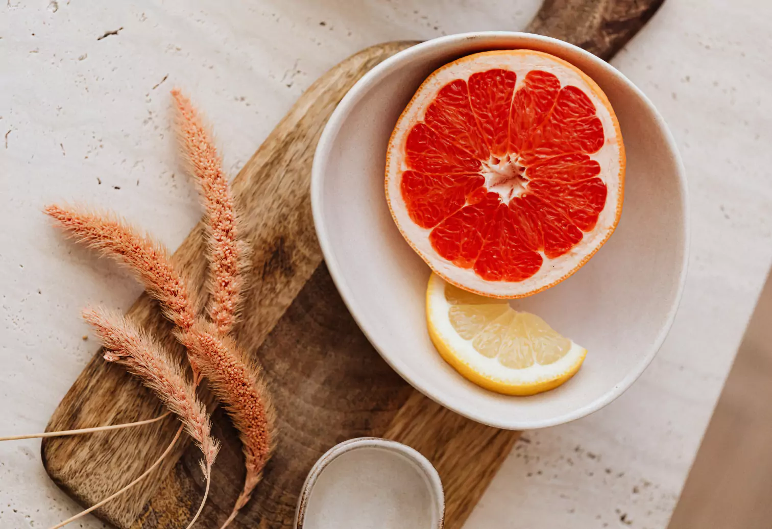 a plate with cut up grapefruit
