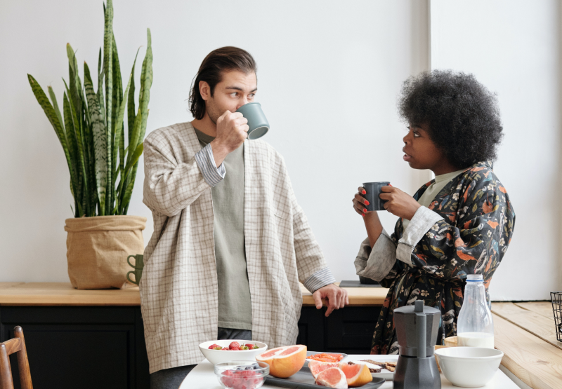 Man and woman drinking coffee and talking 