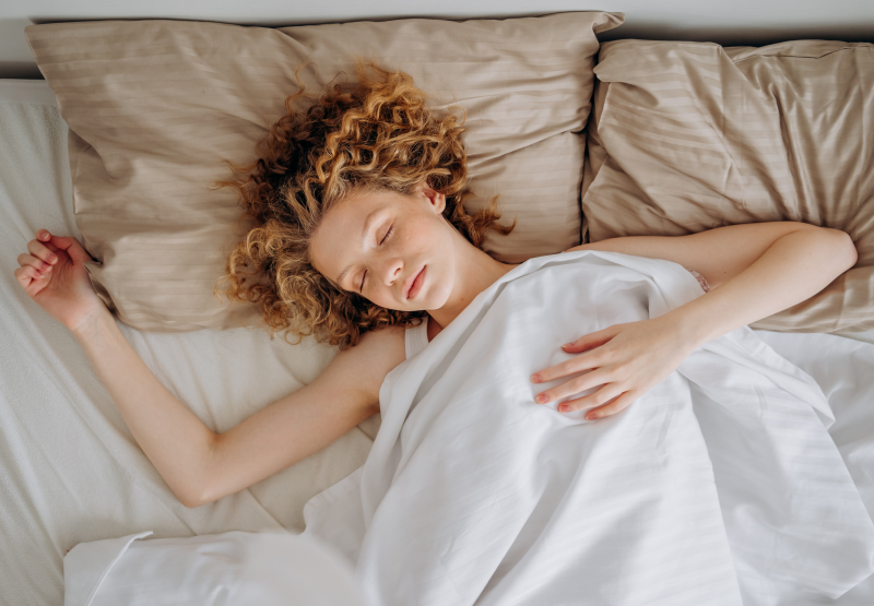 Woman sleeping on bed