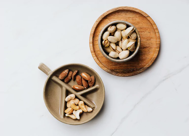 two plates with an assortment of nuts