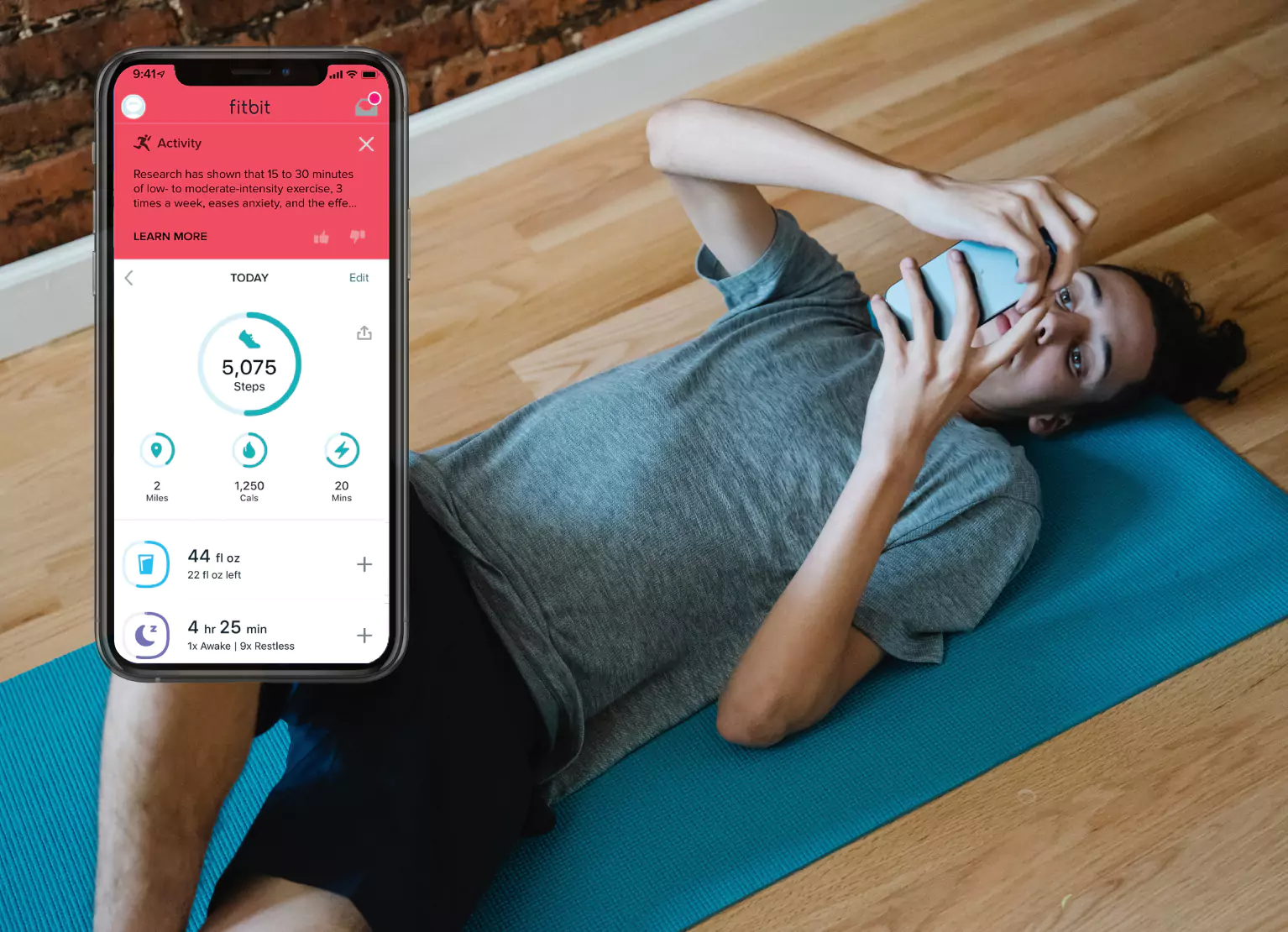 A person stretching while tracking their steps