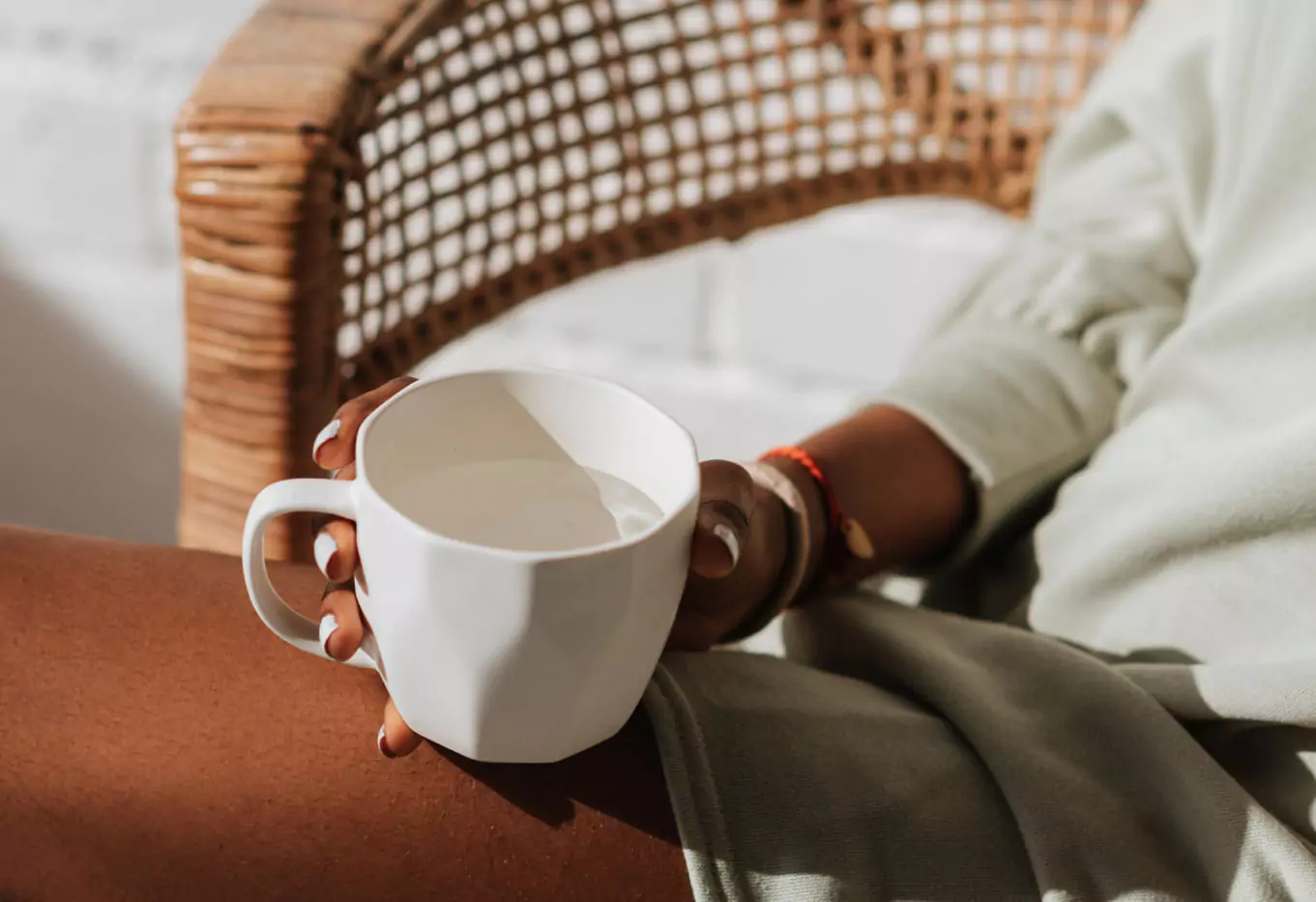 a person holding a cup