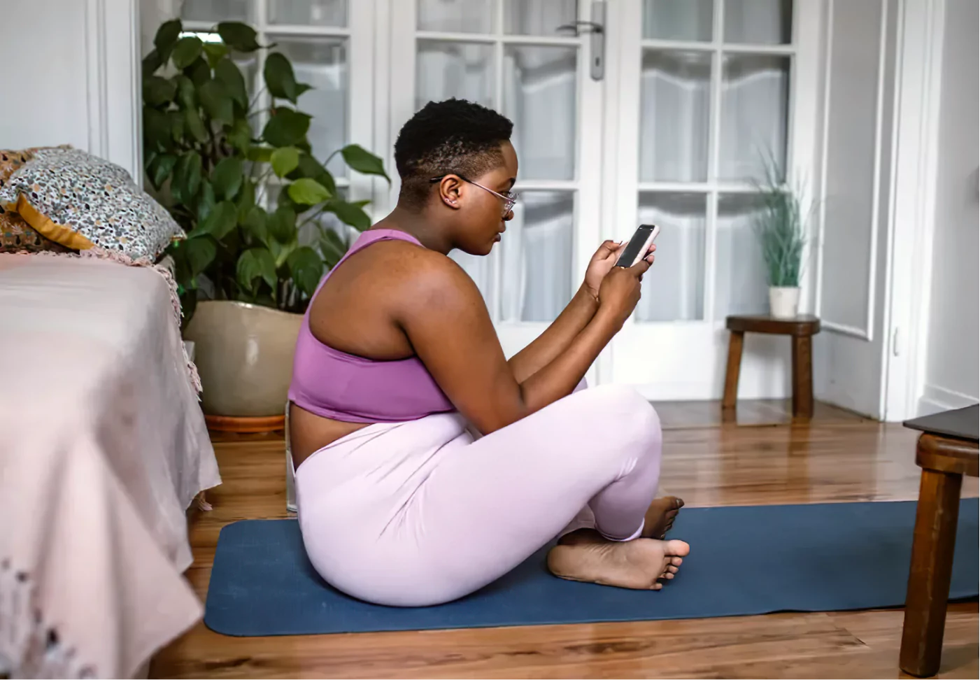 a woman doing a workout in her living room